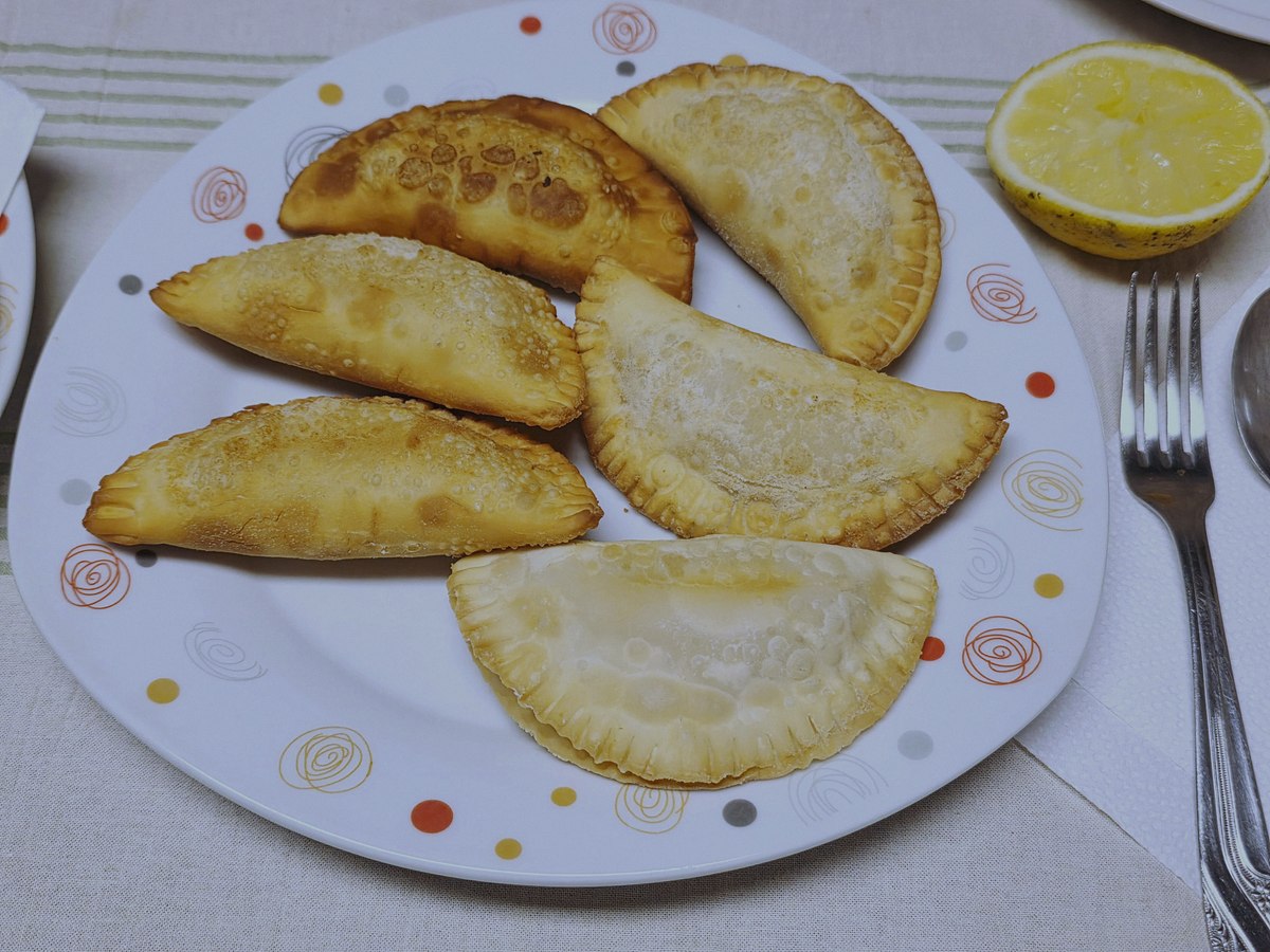 Photographs page: fried empanadas de pollo, photograph by Horacio Cambeiro
