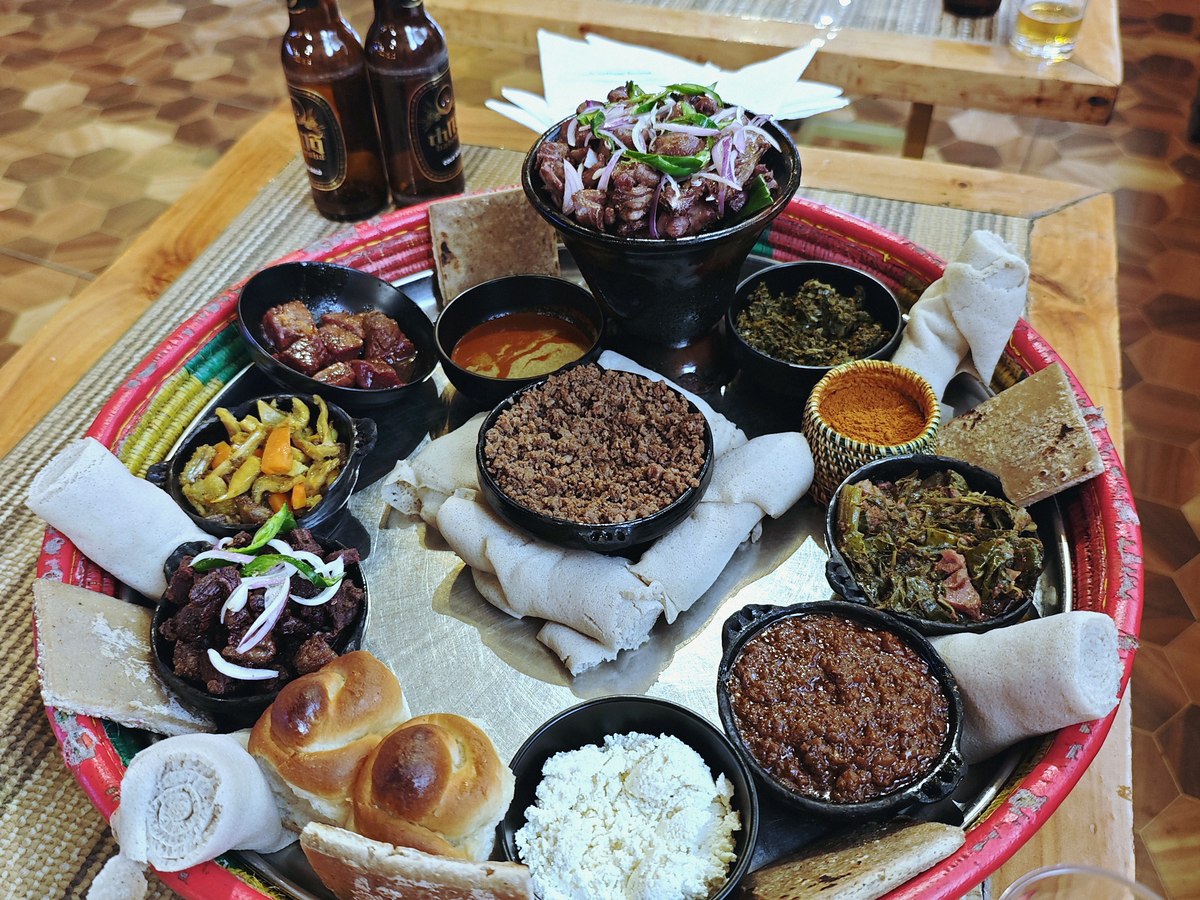 Photographs page: injera with a traditional platter, photograph by FrogsLegs71